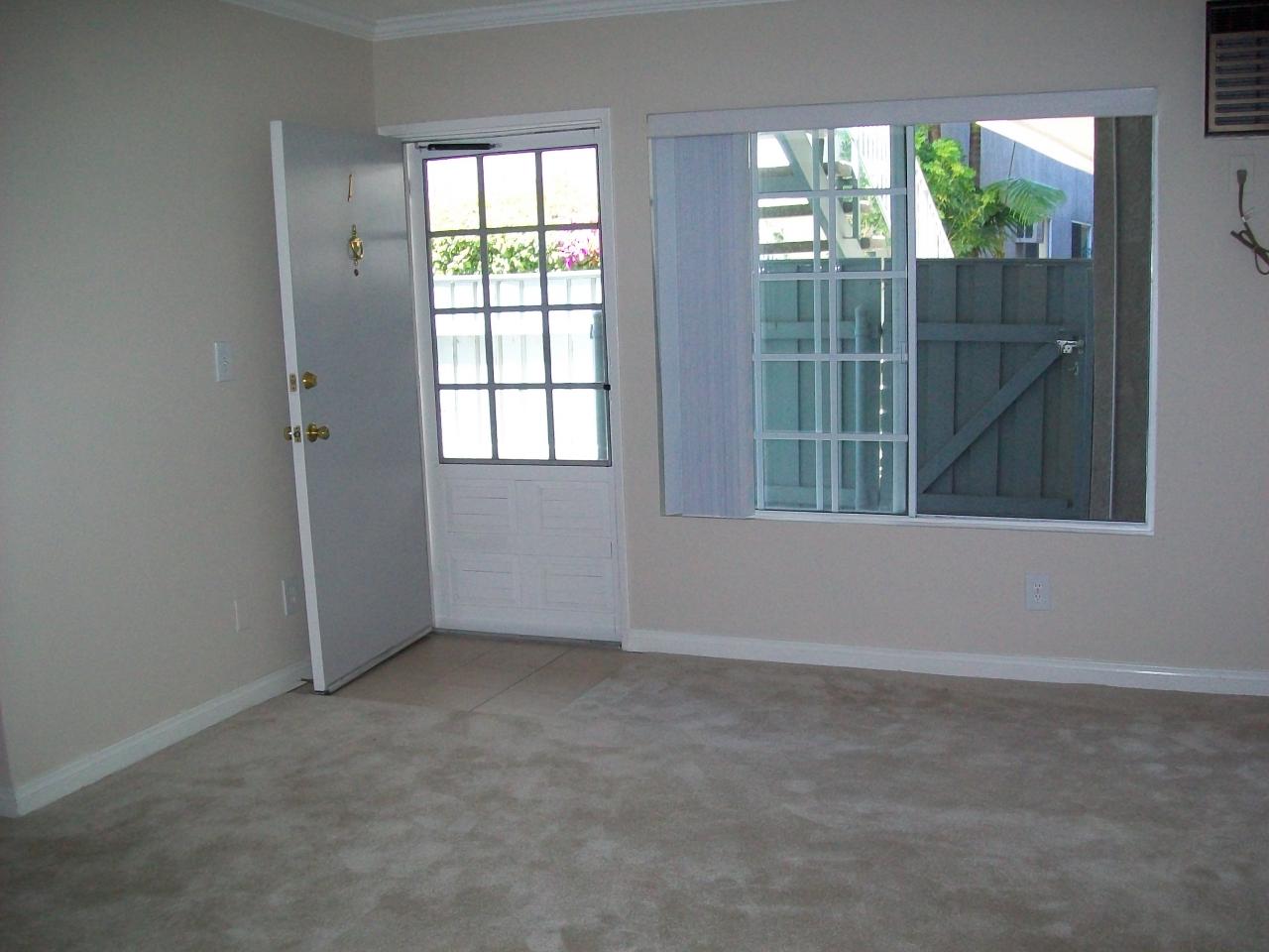 Photo of Kingsbury Villas Apartments - a view of an apartment interior living room with front door